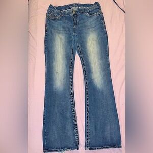 Women’s size 31Wx33L vanity jeans with gold sequin pockets